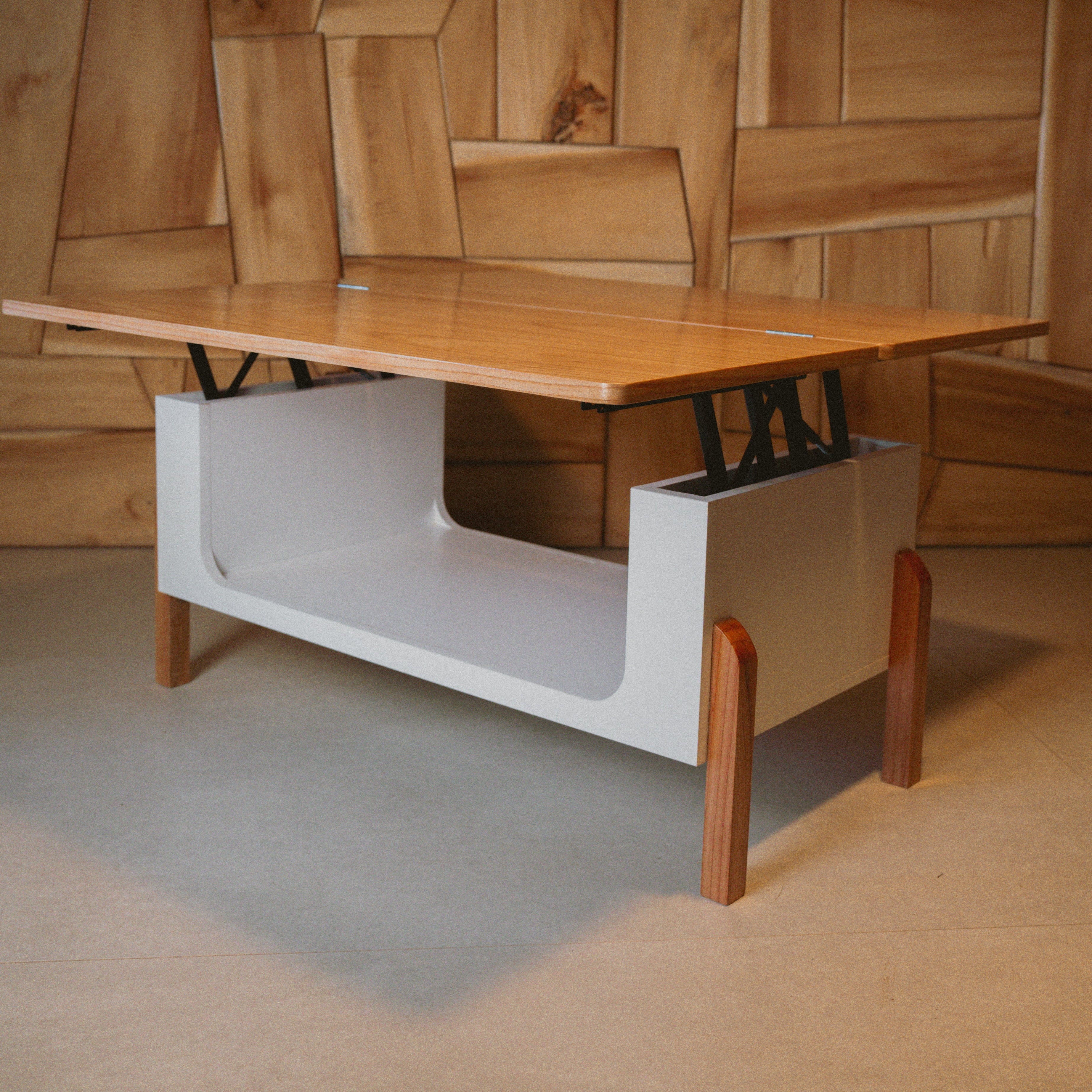 Mesa ratona elevable LIFT elevada en ambiente minimalista, combinando funcionalidad y diseño moderno